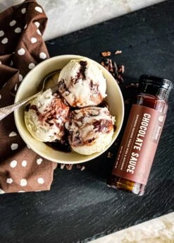 Chocolate Sauce W/ Bourbon Smoked Cacao Nibs & Bourbon -Home Goods Store Bourbon Barrel Foods Chocolate Sauce with Cacao Nibs 7 scaled 1