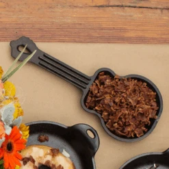 Lodge: Guitar Skillet -Home Goods Store LGSK Guitar Skillet Lifestyle1 WEB 800x800 b69c19ca 03c3 4a0e 9101 02b2b963b163